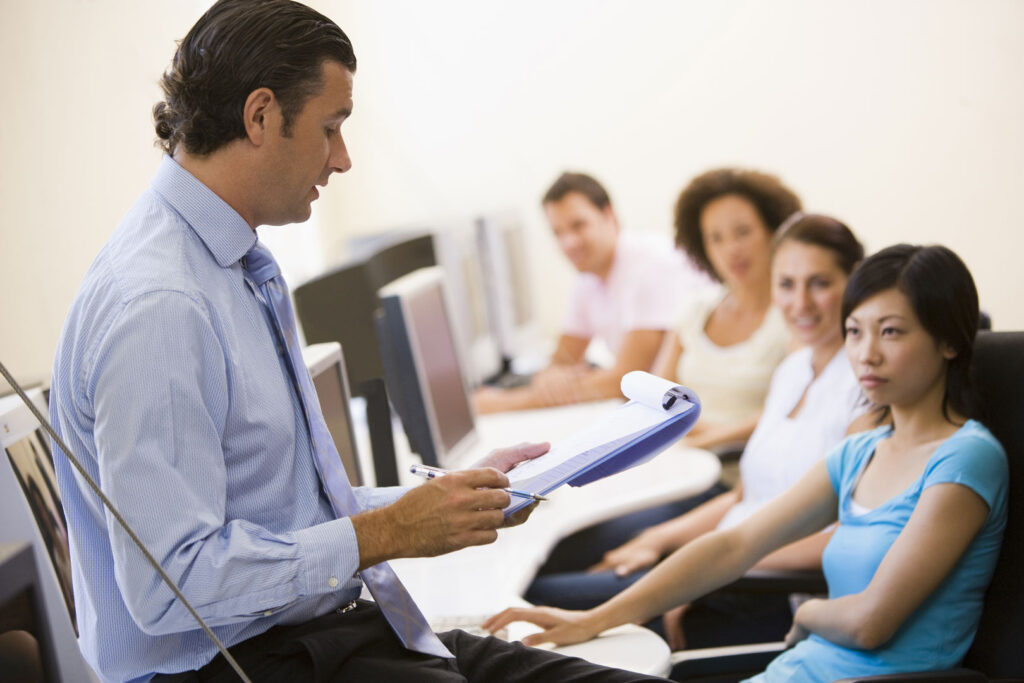 Clarity Psychologist delivering mental health training to diverse group in learning environment