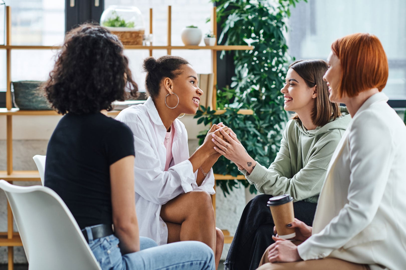 Women in discussion during support session at Clarity Psychology positive behaviour support program.